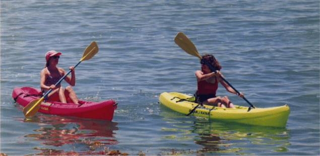 two women kayaking in the waters of little habor campground catalina island